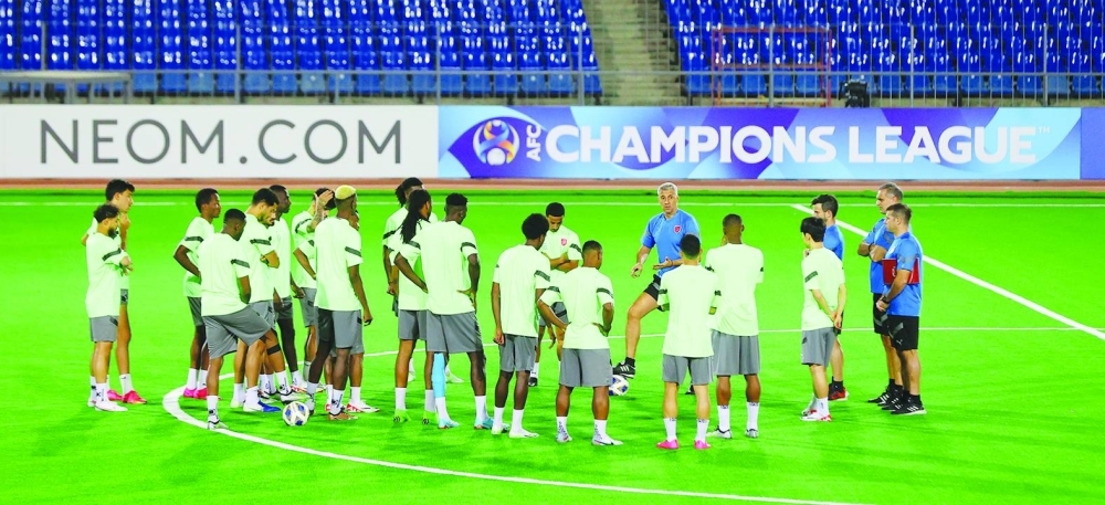 Al Duhail coach Hernan Crespo speaks to his players during a training session in Dushanbe, Tajikistan, on Monday.