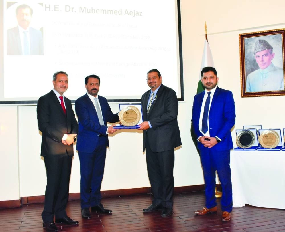 
ICAP Qatar chapter presents a memento to ambassador of Pakistan to Qatar, Dr Muhemed Aejaz. Right: The ICAP-Pakistan Embassy event to discuss taxation issues. 