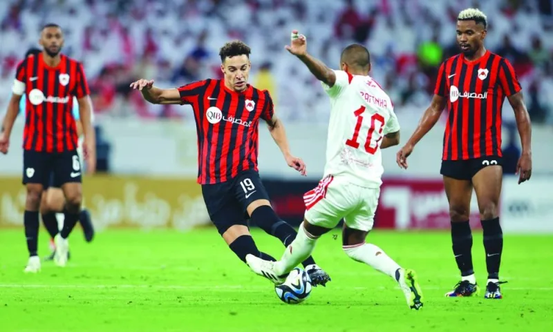 Al Rayyan’s Rodrigo Moreno (left) vies for the ball with Al Arabi’s Rafinha during the Expo Stars League match at the Ahmad Bin Ali Stadium on Saturday.