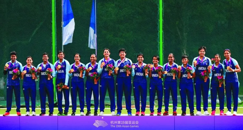 India’s women cricketers pose with their gold medals after winning the final against Sri Lanka at the Hangzhou Asian Games on Monday. (AFP)