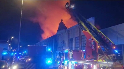 A screenshot from the footage released on the X account of Murcia&#039;s fire service that shows firefighters working to control flames inside the nightclub. The fire had destroyed part of the roof, the footage showed.
