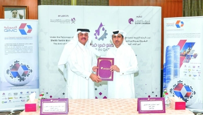 Qatar Chamber general manager Saleh bin Hamad al-Sharqi and QIMC CEO Abdulrahman bin Abdulla al-Ansari during the signing ceremony.