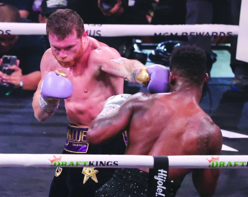 
Canelo Alvarez (left) hits Jermell Charlo in the fifth round of their super middleweight title fight at T-Mobile Arena in Las Vegas, Nevada. Alvarez won by unanimous decision. (AFP) 