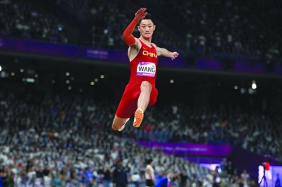 China’s Wang Jianan competes in the men’s long jump final during the 2022 Asian Games in Hangzhou on Sunday. Jianan won the gold medal with an impressive 8.22m on his first attempt. (AFP)