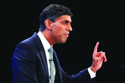 
British Prime Minister Rishi Sunak speaks on stage at Conservative Party’s annual conference in Manchester yesterday. 