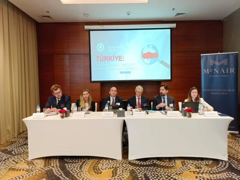 Speakers address McNair International and Moroğlu Arseven seminar.