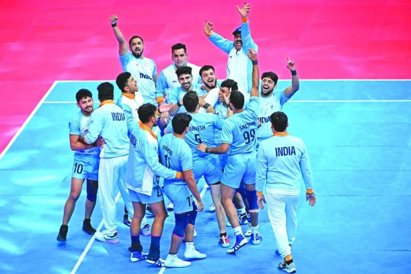 India players celebrate their victory in kabaddi final against Iran during the Hangzhou 2022 Asian Games on Saturday. (AFP)