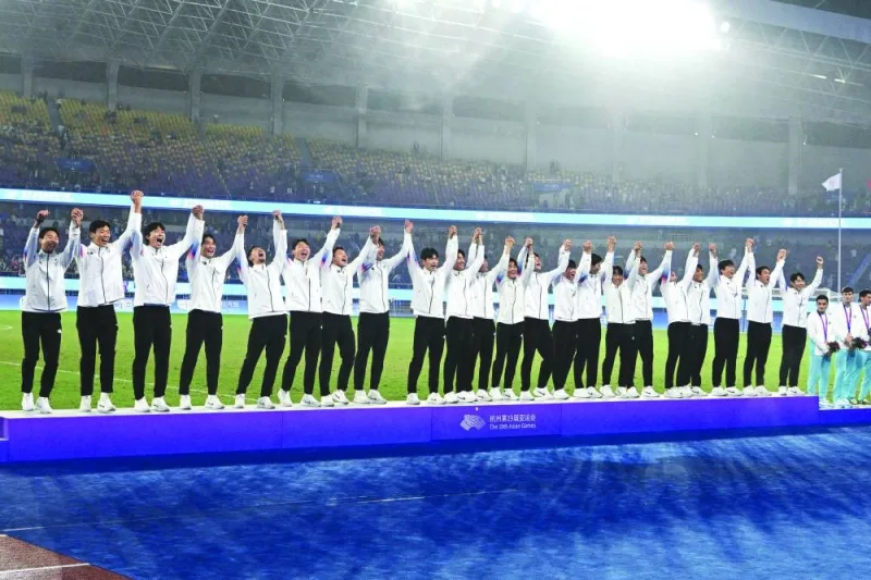 Gold medallist South Korea’s football team pose during the medal ceremony on Saturday. (AFP)
