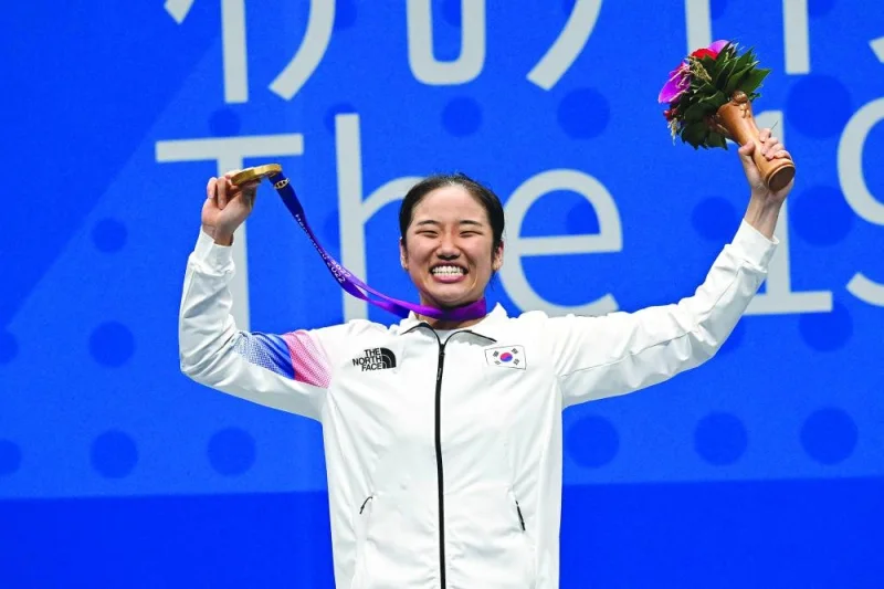 South Korea’s An Se-young celebrates after winning badminton gold on Saturday. (AFP)