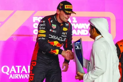 Qatar Olympic Committee President HE Sheikh Joaan bin Hamad al-Thani presents the winner’s trophy to Max Verstappen of Red Bull after his win in Formula 1 Qatar Airways Qatar Grand Prix 2023 at Lusail International Circuit Sunday. Reuters