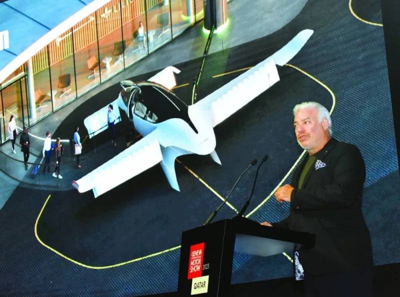 Frank Stephenson speaking in Doha Monday. Seen in the background is an image of a model of an electric aircraft. PICTURE: Thajudheen.