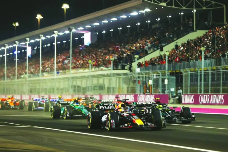 Max Verstappen, Red Bull Racing RB19, leads Sir Lewis Hamilton, Mercedes F1 W14, Fernando Alonso, Aston Martin AMR23, Charles Leclerc, Ferrari SF-23, and the rest of the field at the start.