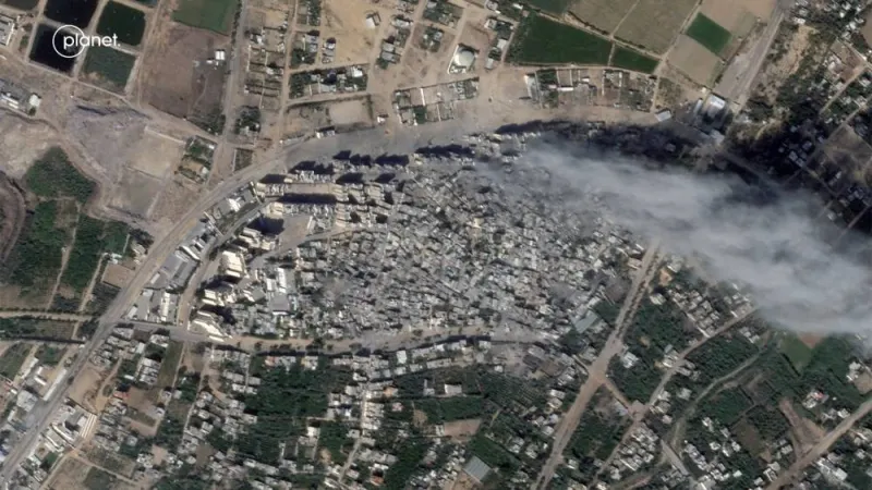 Satellite view of smoke over heavily damaged areas from Israeli strikes in the Palestinian city of Beit Hanoun, northern Gaza Strip Monday. Planet Labs PBC/Handout via REUTERS