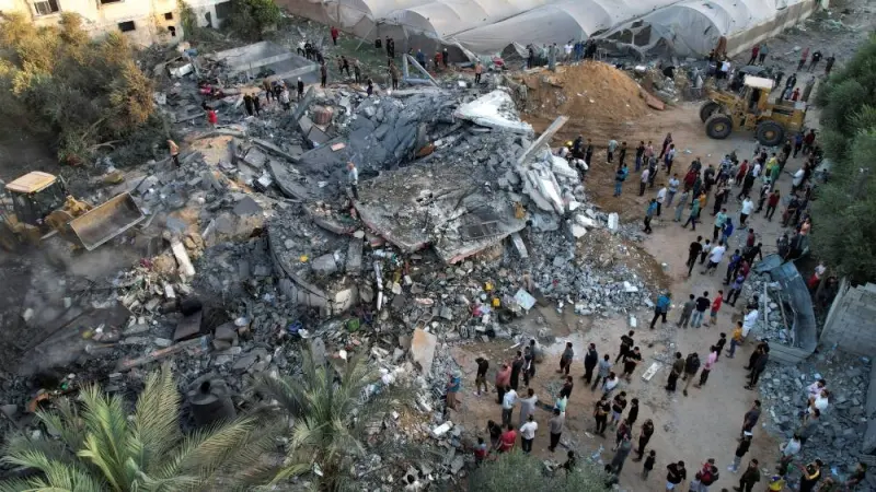 A view shows the remains of a Palestinian house destroyed in Israeli strikes in the central Gaza Strip Monday. REUTERS