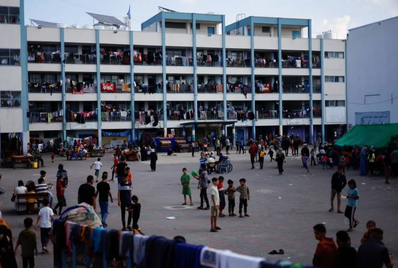 Palestinians, who fled their houses amid Israeli strikes, shelter at a United Nations-run school, after Israel&#039;s call for more than 1 million civilians in northern Gaza to move south, in Khan Younis in the southern Gaza Strip, Monday. REUTERS