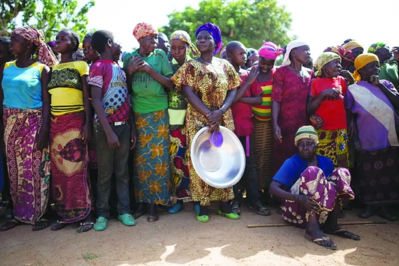 
FILE PHOTO: Women stand in line for food aid distribution delivered by the UN Office for the Co-ordination of Humanitarian Affairs and World Food Programme in the village of Makunzi Wali, Central African Republic. 