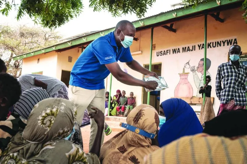
FILE PHOTO:  World Food Programme staff engages with the local community and beneficiaries of their programme in Wajir, northeastern Kenya. 