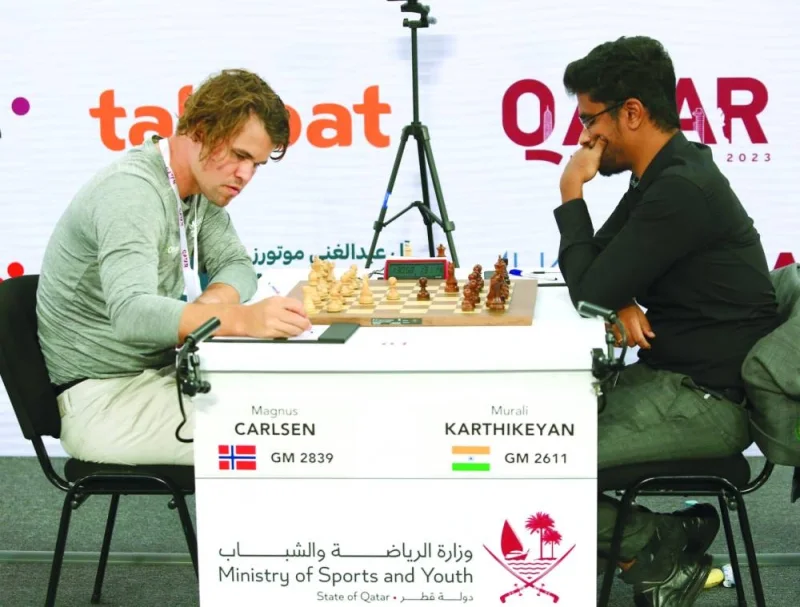 
World No. 1 Magnus Carlsen and Indian GM Murali Karthikeyan in action during the seventh round of Qatar Masters 2023 at Lusail Sports Arena. 
