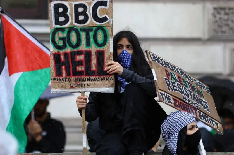 A demonstrator holds a sign, at a protest in solidarity with Palestinians in Gaza, amid the ongoing conflict between Israel and the Palestinian group Hamas, in London, Saturday. REUTERS