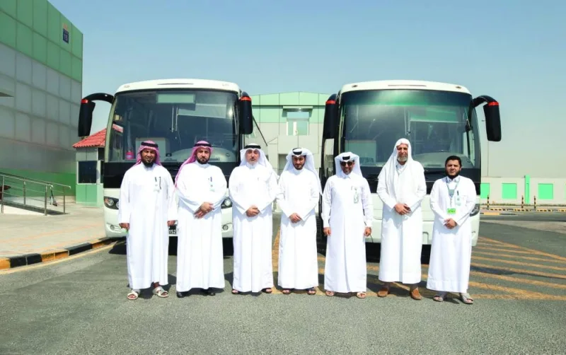 Officials of Mowasalat (Karwa) and Qatar Guest Centre in a group photo.