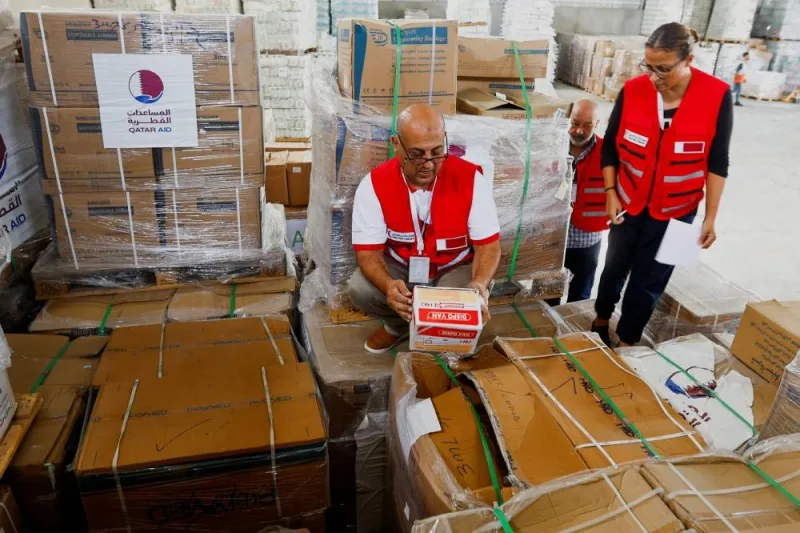 Red Crescent workers sort aid before being distributed to Palestinians, as the conflict between Israel and Palestinian Islamist group Hamas continues, in Khan Younis in the southern Gaza Strip, on Monday. REUTERS