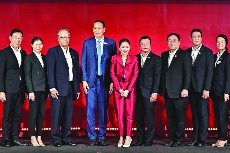 Newly-elected Pheu Thai Party leader Paetongtarn Shinawatra (centre right), youngest daughter of former Thai prime minister Thaksin Shinawatra, poses for photos with Thailand’s Prime Minister Srettha Thavisin (centre left) and party members at the Pheu Thai Party headquarters in Bangkok on Friday.