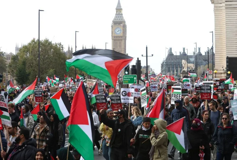 Demonstrators protest in solidarity with Palestinians in Gaza, in London, Britain, Saturday. REUTERS