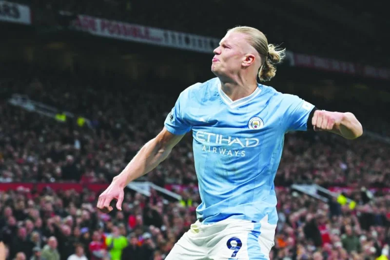 
Manchester City’s Erling Haaland celebrates after scoring the opening goal from the penalty spot during the English Premier League match against Manchester United at Old Trafford in Manchester yesterday. (AFP) 