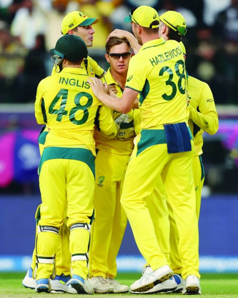 
Australia’s Adam Zampa celebrates a wicket with teammates during a World Cup match against New Zealand. (@CricketAus)  