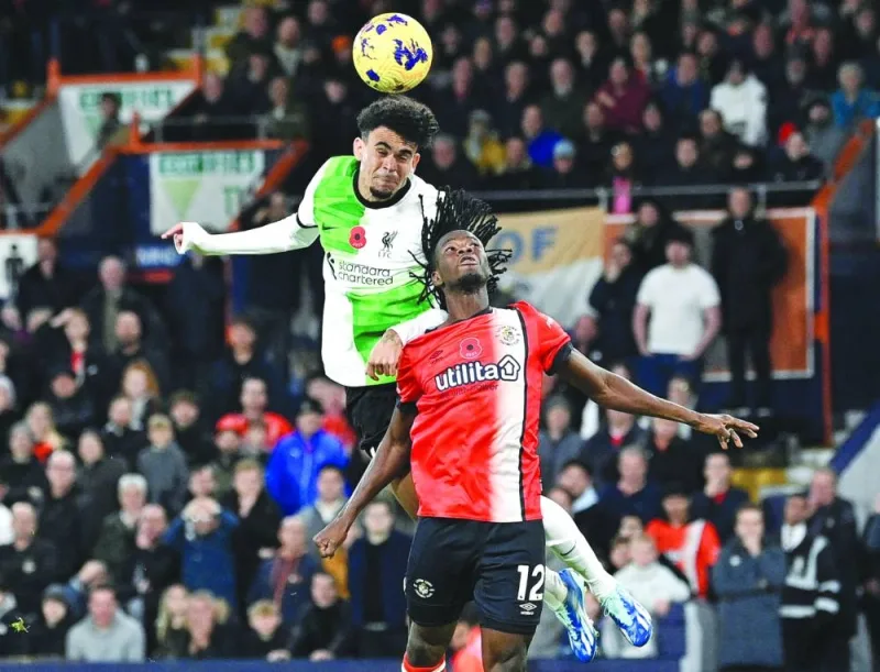 Liverpool’s Luis Diaz (left) scores the equalising goal during the Premier League match against Luton Town at Kenilworth Road in Luton on Sunday. (AFP)