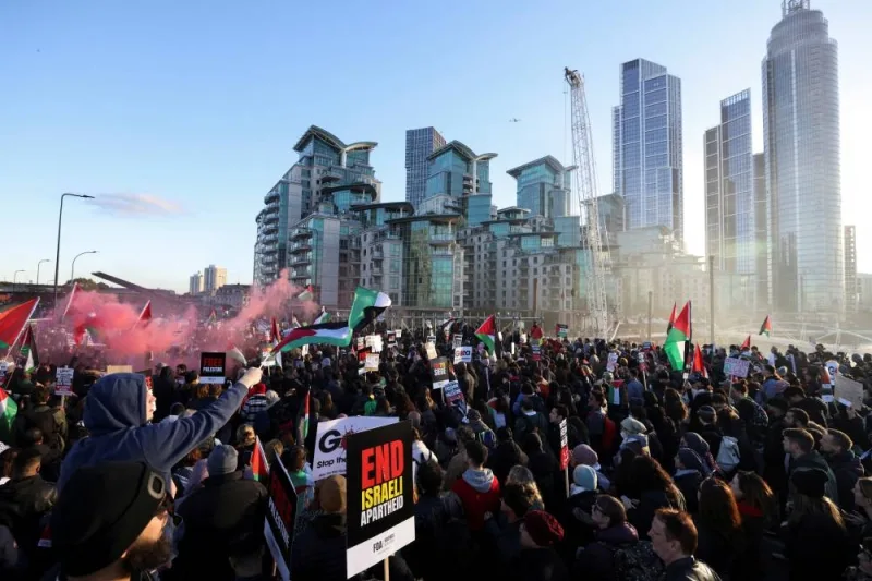 People demonstrate on Vauxhall Bridge during a protest in solidarity with Palestinians in Gaza, in London, on Saturday. REUTERS