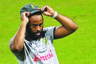South Africa’s captain Temba Bhavuma adjusts his cap during a practice session at the Eden Gardens in Kolkata ahead of their ICC World Cup semi-final against Australia. 