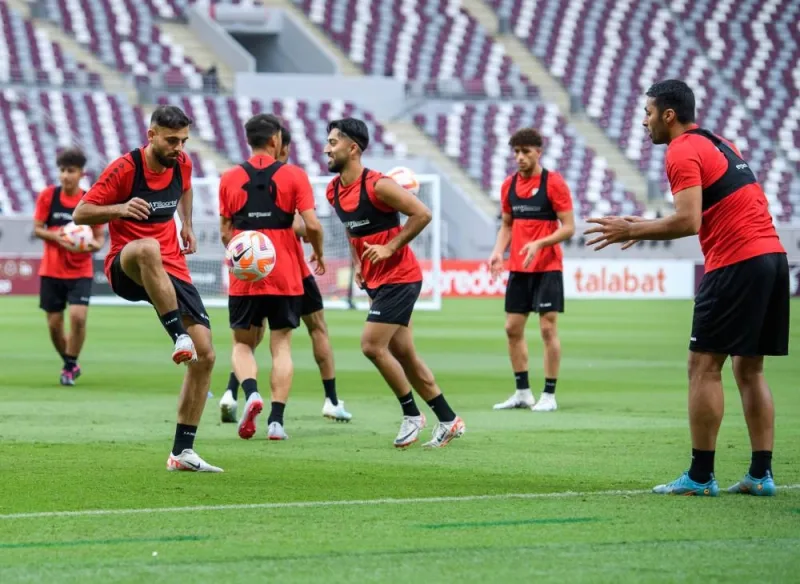 
Qatar’s head coach Carlos Queiroz talks to his players during a training session at the Khalifa International Stadium yesterday.  PICTURE: Noushad Thekkayil 