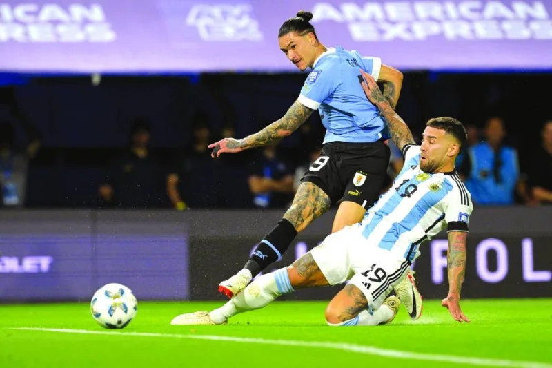 
Uruguay’s forward Darwin Nunez (left) and Argentina’s defender Nicolas Otamendi vie for the ball during the 2026 FIFA World Cup South American qualification match at La Bombonera stadium in Buenos Aires on Thursday night. (AFP) 