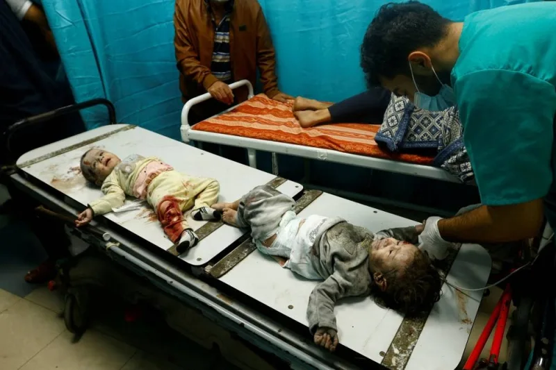 Palestinian children wounded in an Israeli strike are assisted at Nasser hospita in Khan Younis in the southern Gaza Strip , on Saturday. REUTERS