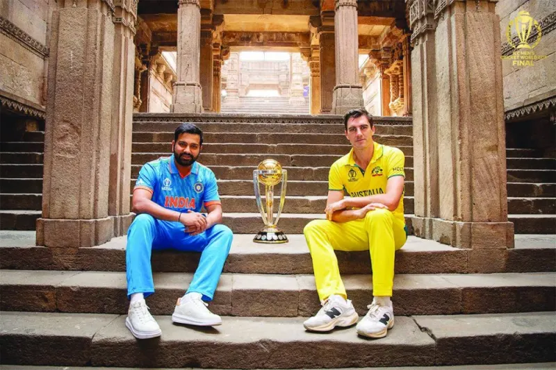 
India’s captain Rohit Sharma (left) and his Australian counterpart Pat Cummins pose with the ICC World Cup trophy yesterday, on the eve of the final in Ahmedabad. 