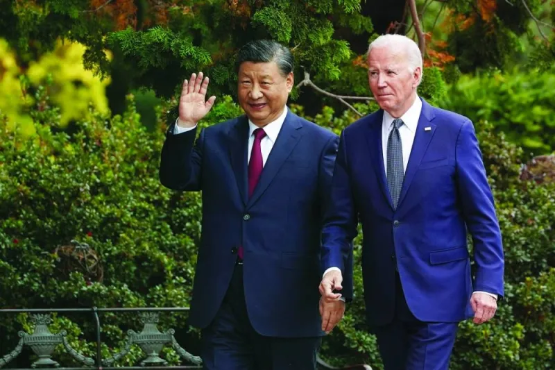 
Chinese President Xi Jinping waves as he walks with US President Joe Biden at Filoli estate on the sidelines of the Asia-Pacific Economic Co-operation summit, in Woodside, California, on Wednesday. (Reuters) 