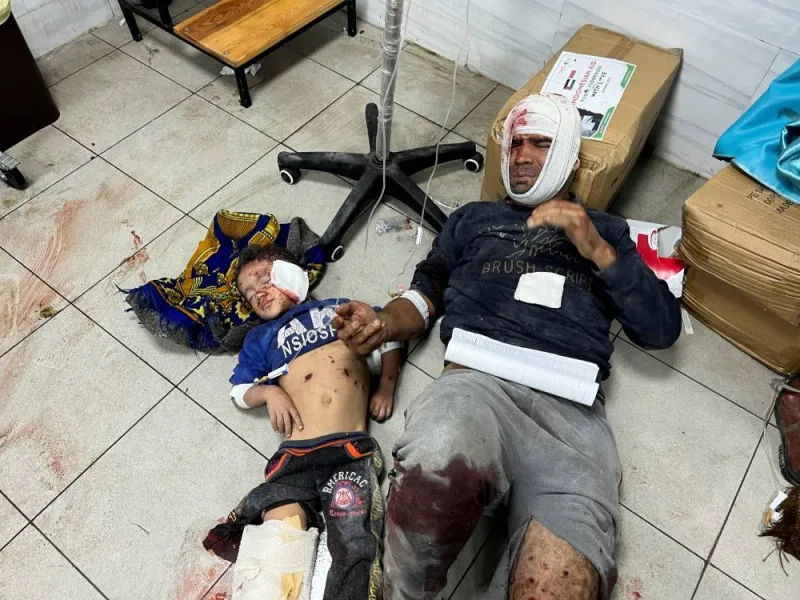 Palestinians wounded in Israeli strikes lie on the floor at the Indonesian hospital, on Sunday. REUTERS