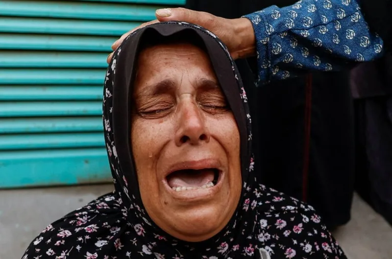A woman reacts as relatives of Palestinians killed in Israeli strikes mourn at Nasser hospital in Khan Younis in the southern Gaza Strip, on Sunday. REUTERS