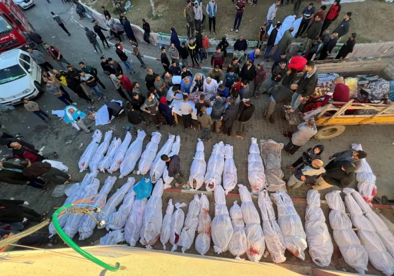 People gather near the bodies of Palestinians killed in Israeli strikes at the Indonesian hospital, in the northern Gaza Strip, on Saturday. REUTERS
