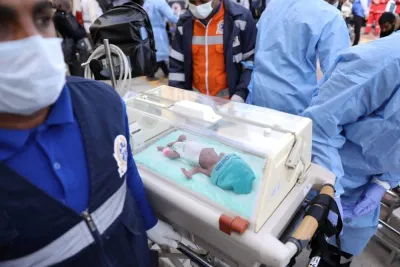 Medics transfer a premature Palestinian baby in an incubator, evacuated from Gaza to an ambulance on the Egyptian side of the Rafah border, amid the ongoing conflict between Israel and the Palestinian Islamist group Hamas, in Rafah, Egypt on Monday. The Egyptian Health Ministry/Handout via REUTERS 