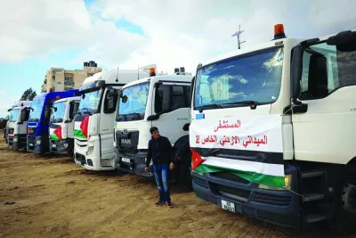 
An aid convoy transporting a Jordanian field hospital is seen parked upon arrival in Khan Yunis in the southern Gaza Strip, yesterday, after crossing through the Rafah border crossing with Egypt. 