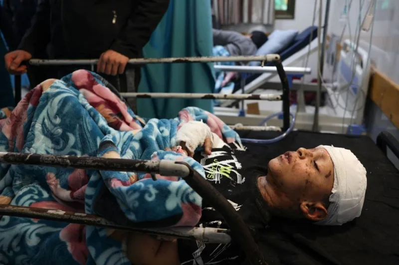 Wounded Palestinian Mohammed Wesam Qadora from the Jabalia refugee camp arrives at the Naser Hospital at Khan Yunis after being transferred from the Indonesian Hospital to the southern Gaza Strip, on Tuesday. AFP