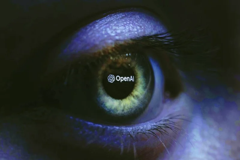 
This illustration photograph taken with a macro lens shows an OpenAI logo reverse projected onto a human eye at a studio in Paris. (AFP) 
