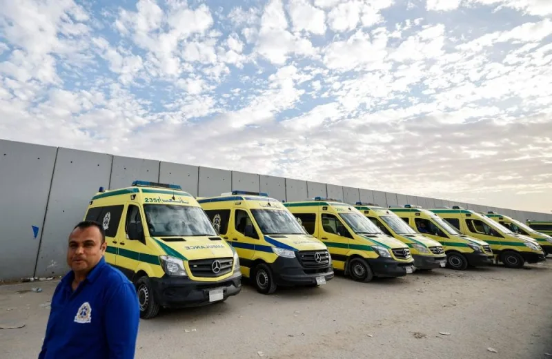 Ambulances are parked at the Egyptian side of the Rafah border crossing with the Gaza Strip on Wednesday. AFP