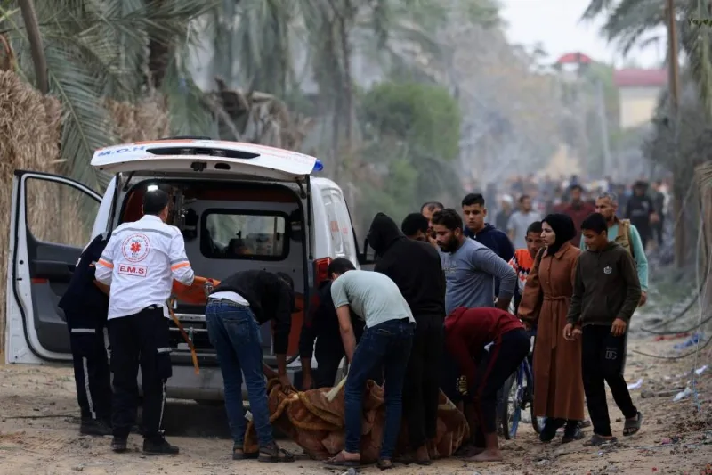 Palestinians evacuate a body after an Israeli strike in Khan Yunis, in the southern Gaza Strip on Wednesday. AFP