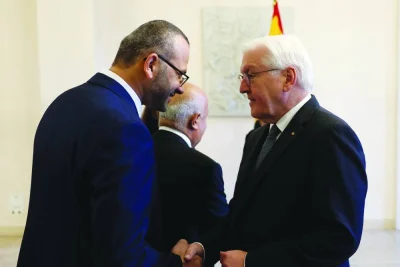 German President Frank-Walter Steinmeier greets Ahmed Abunada (left), chief specialist for vascular surgery at Al-Shifa Hospital in Gaza, who has recently returned from the Gaza Strip, at the Schloss Bellevue presidential palace in Berlin, yesterday.