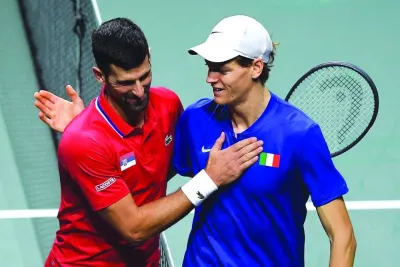 
Italy’s Jannik Sinner (right) greets Serbia’s Novak Djokovic after 
winning the second semi-final of the Davis Cup at the Martin Carpena sportshall in Malaga, Spain, yesterday. (AFP) 