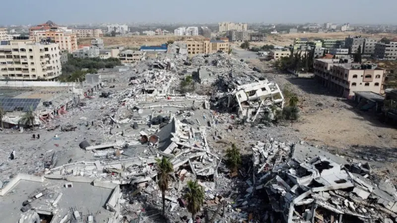 Residential buildings, destroyed in Israeli strikes during the conflict, lie in ruin, amid a temporary truce between Israel and Hamas, in southern Gaza City on Sunday. REUTERS