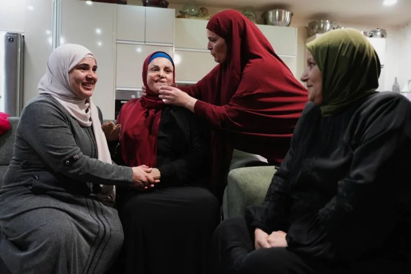 Released Palestinian prisoner Israa Jaabis is received by her family in her house in Jerusalem, on Sunday. REUTERS
